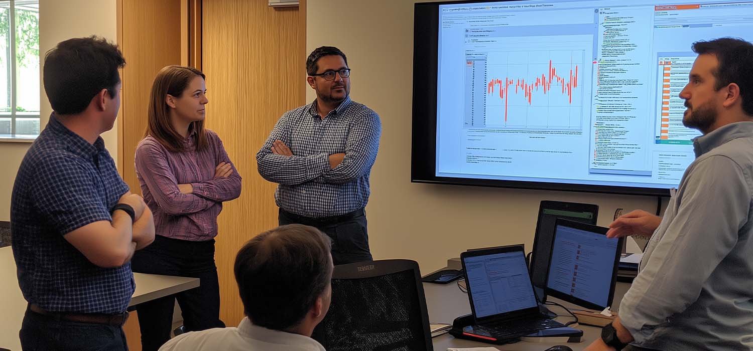 Team discussing incident response strategy with key metrics displayed