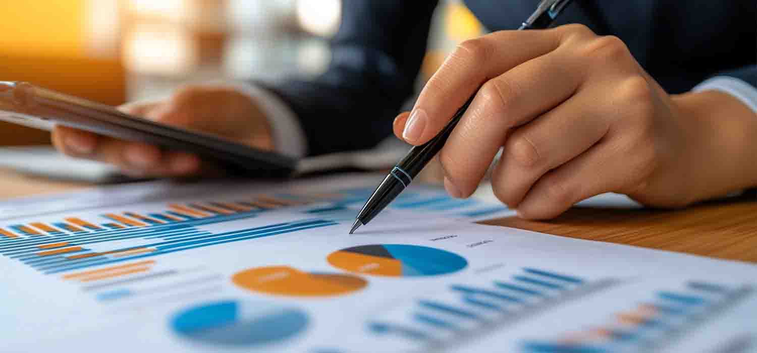 Business owner reviewing IT backup services and cybersecurity reports with their support partner